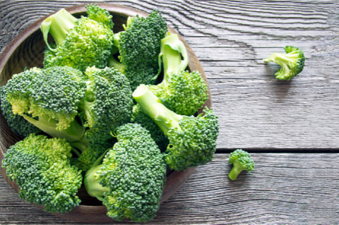 Symbolic image of broccoli and turmeric.