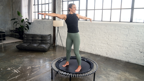 Woman exercising on the bellicon in the living room.