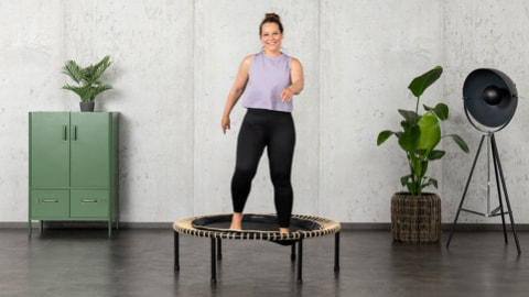 A woman trains on the bellicon trampoline